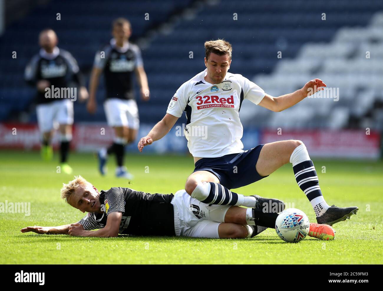 Derby County's Louie Sibley (left) and Preston North End's Paul Huntington battle for the ball during the Sky Bet Championship match at Deepdale, Preston. Stock Photo