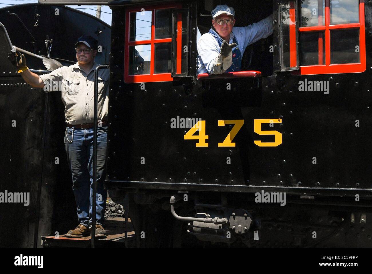 June 29, 2020: The Strasburg Railroad, Norfolk & Western, 475 steam locomotive fireman (left) and engineer (right), wave to passengers as the train changes ends during an excursion on Monday, June, 29, 2020, in Ronks, Pennsylvania. The Strasburg Railroad re-opened for passenger service on Friday, June, 26th, after being closed due to the COVID-19 pandemic. Additional health related safety measures have been put in place for the re-opening. Rich Barnes/CSM Stock Photo