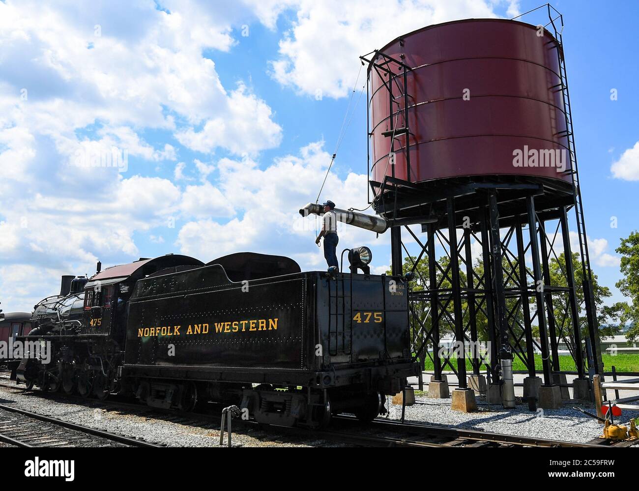 June 29, 2020: The Strasburg Railroad, Norfolk & Western, 475 steam locomotive fireman prepares to fill the water tank following the last excursion of the day on Monday, June, 29, 2020, in Ronks, Pennsylvania. The Strasburg Railroad re-opened for passenger service on Friday, June, 26th, after being closed due to the COVID-19 pandemic. Additional health related safety measures have been put in place for the re-opening. Rich Barnes/CSM Stock Photo