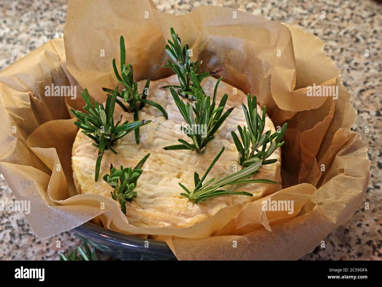 Baked French Camembert cheese and Rosemary - Baked Camembert - Home cooking Stock Photo