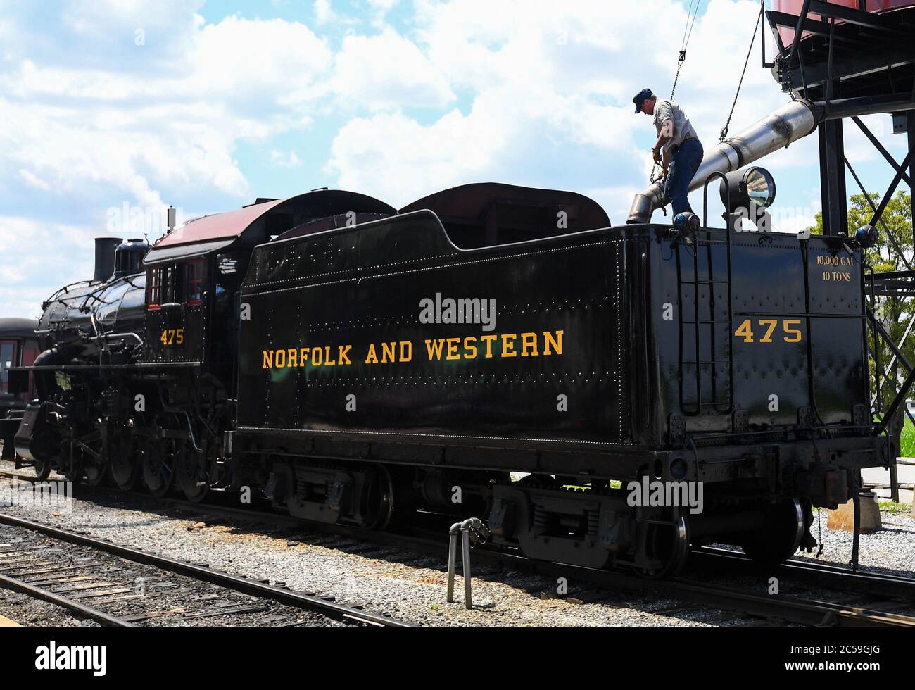 June 29, 2020: The Strasburg Railroad, Norfolk & Western, 475 steam locomotive fireman fills the water tank following the last excursion of the day on Monday, June, 29, 2020, in Ronks, Pennsylvania. The Strasburg Railroad re-opened for passenger service on Friday, June, 26th, after being closed due to the COVID-19 pandemic. Additional health related safety measures have been put in place for the re-opening. Rich Barnes/CSM Stock Photo