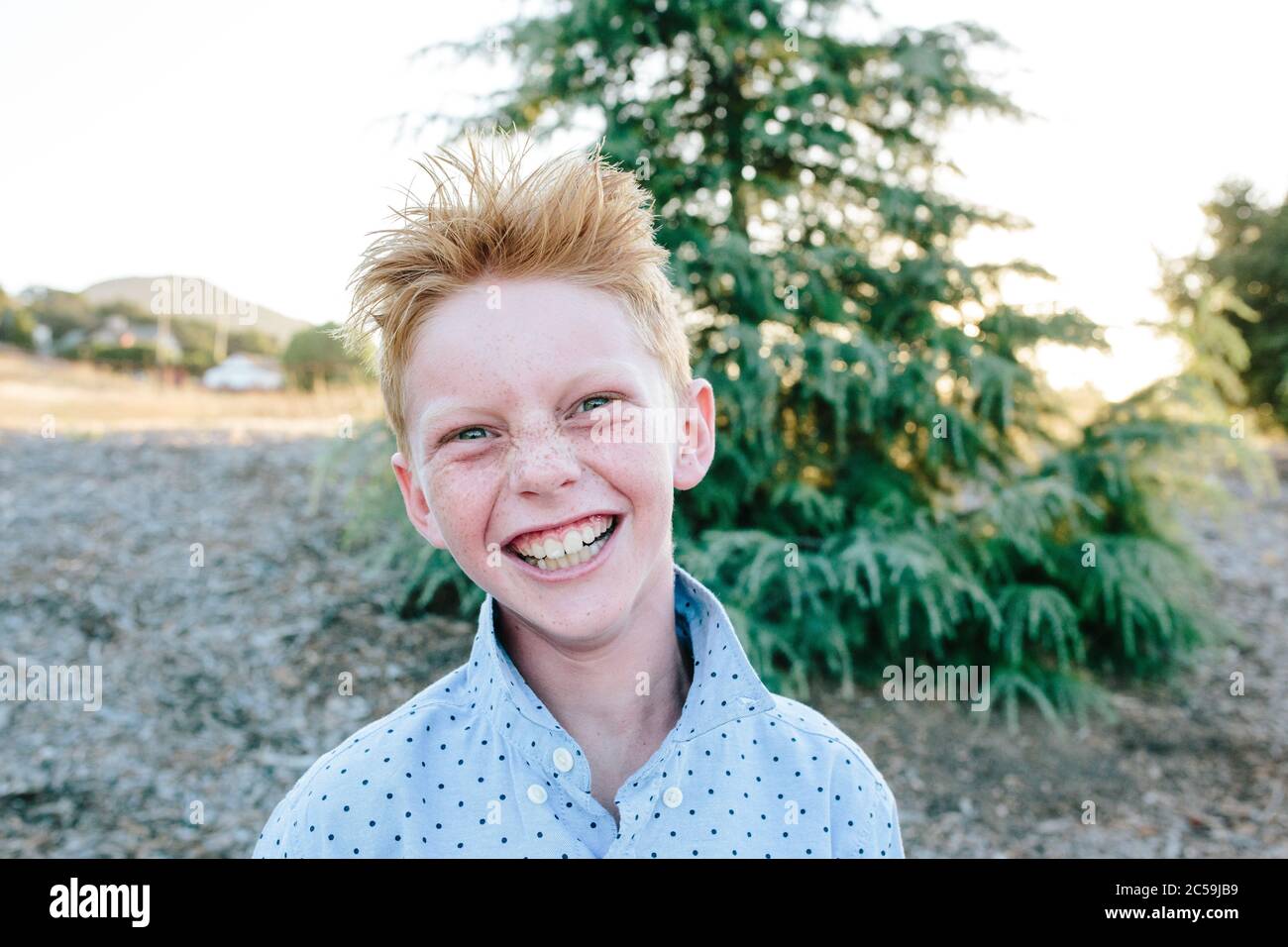A Red Headed Boy With Freckles Smiling A Crazy Smile Stock Photo