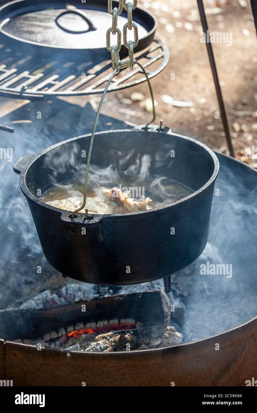 Smoking chicken stock cooked over open wood fire Stock Photo