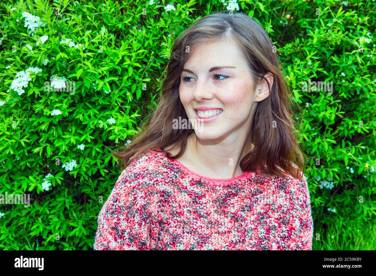 portrait of young beautiful woman smiling outdoors Stock Photo - Alamy