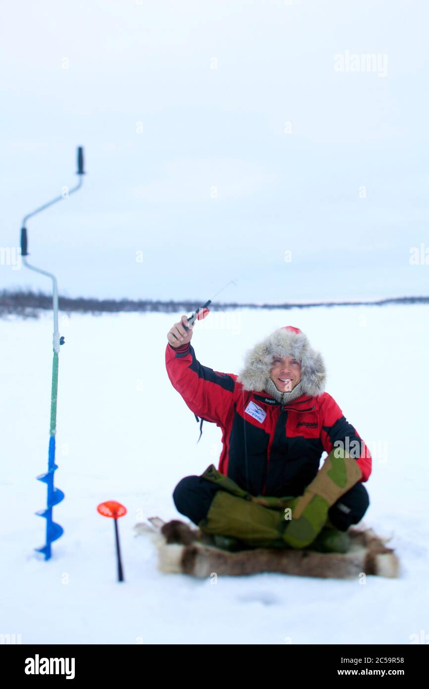 Norway, Lapland, Troms og Finnmark, Karasjok, thomas nilsen guide extreme fishing on a frozen lake Stock Photo
