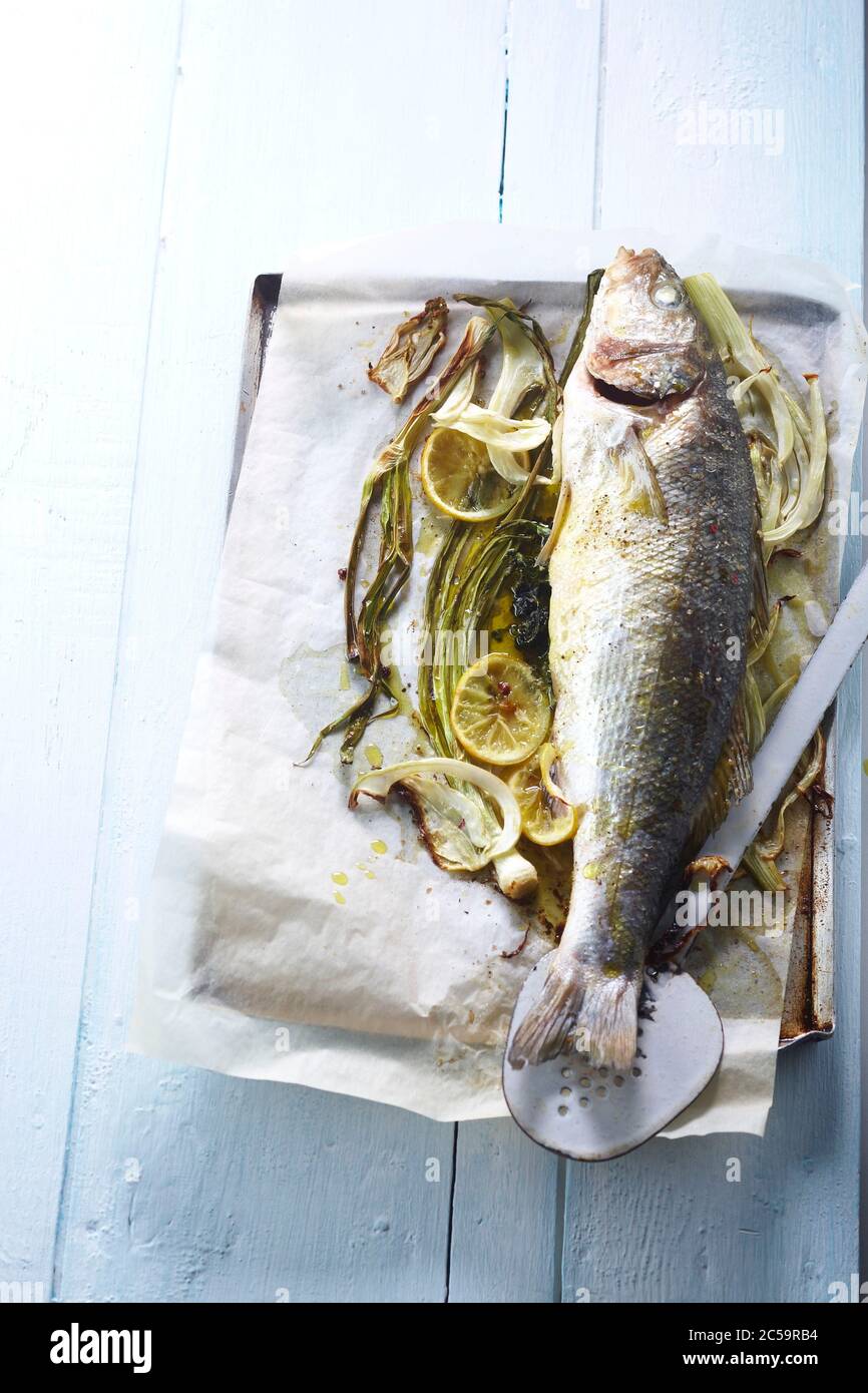 Whole baked sea bass Stock Photo - Alamy