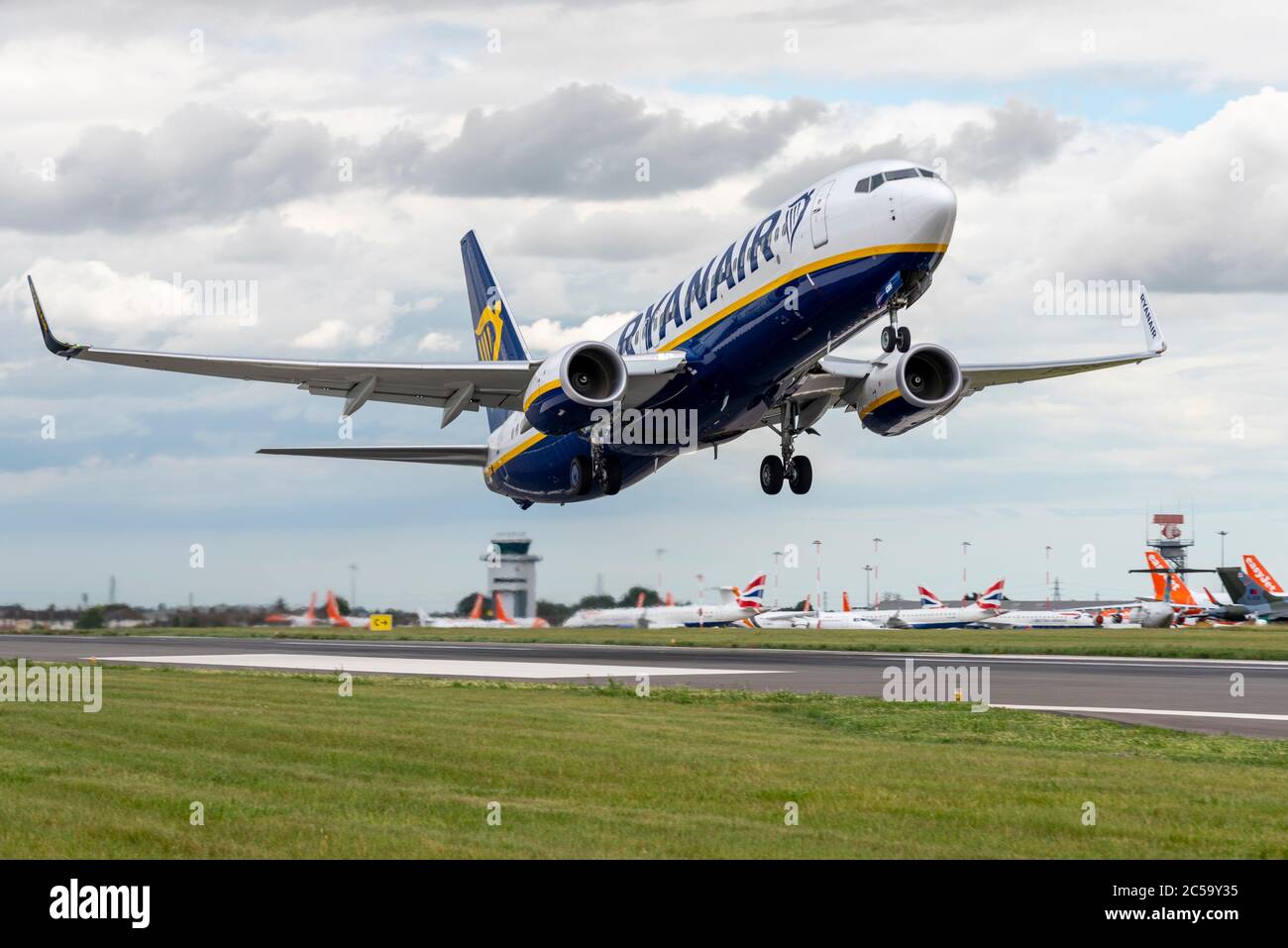 First passenger flight taking off from London Southend Airport, Essex, UK, after the COVID-19 Coronavirus lockdown. Ryanair flying over easyJet jets Stock Photo