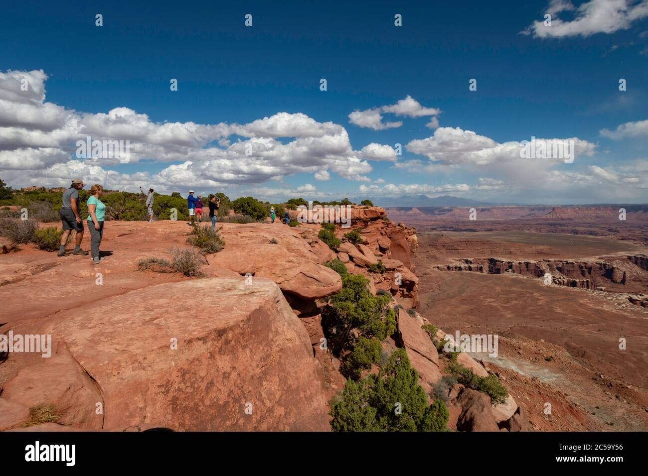 Visitors to Canyonlands National Park in Utah taking photos of the sweeping vistas. Stock Photo