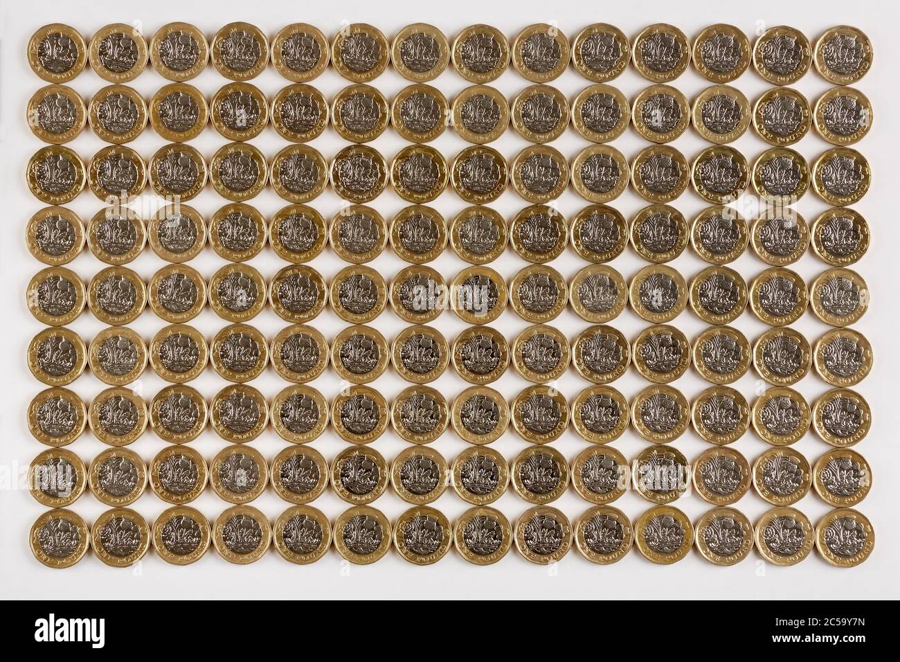 Photograph of multiple rows of new UK £1 pound coins (new £1 coins in circulation after October 2017) Stock Photo