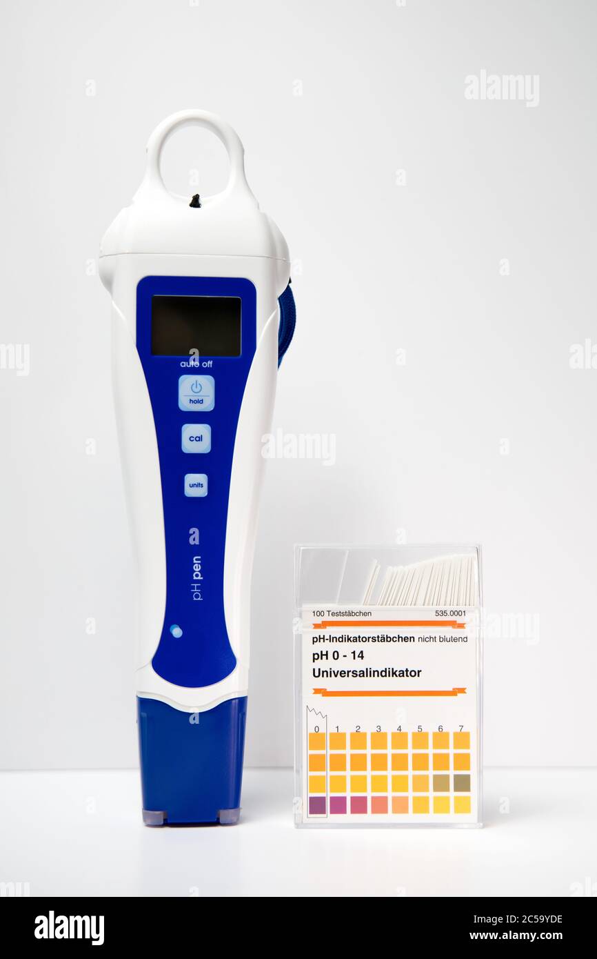 A modern digital pH meter next to a box of paper pH strips. pH measuring.  Translation right box: "100 test strips. pH-indicatorstrips, not bleeding  Stock Photo - Alamy