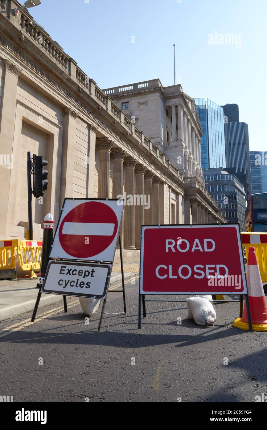 Photograph of the Bank of England with 'Road Closed' and ' No Entry except cycles' sign in front of building. Stock Photo