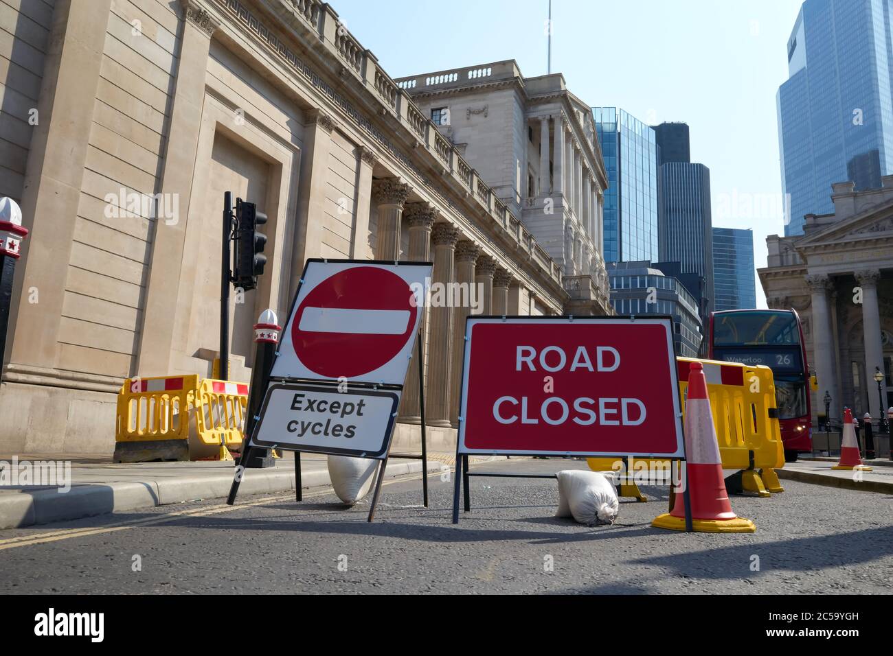 Photograph of the Bank of England with 'Road Closed' and ' No Entry except cycles' sign in front of building. Stock Photo