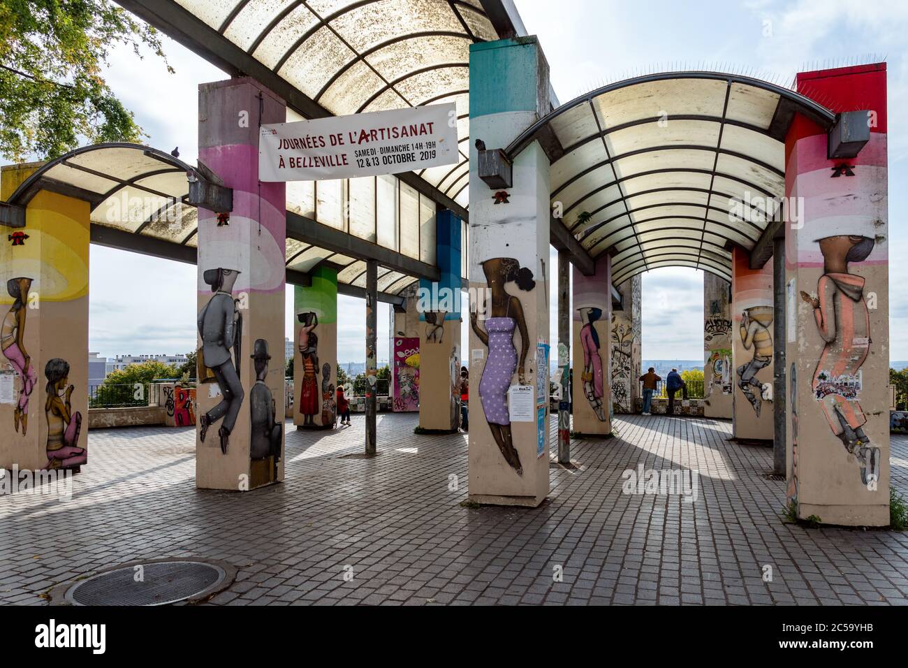 Tourists viewing murals in Belleville, Paris