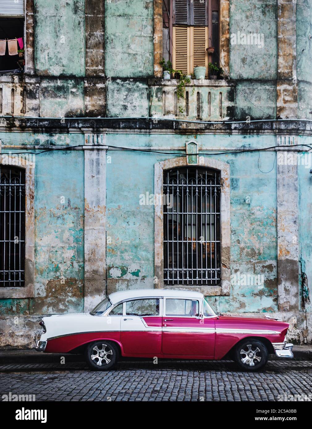 Pink 1950's car on the street in Havana, Cuba Stock Photo