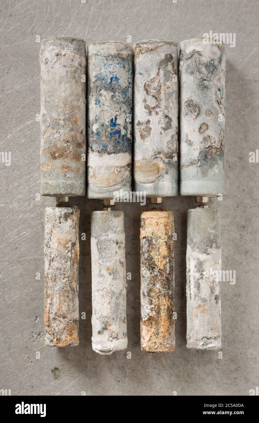 Electrolytic action on batteries from leaking and old age causing alkaline  corrosion and deposits of aluminium and zinc chloride Stock Photo - Alamy