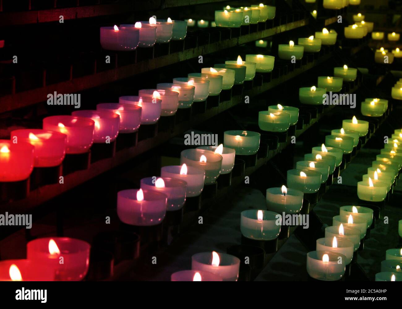 Burning candles in catholic church Stock Photo Alamy