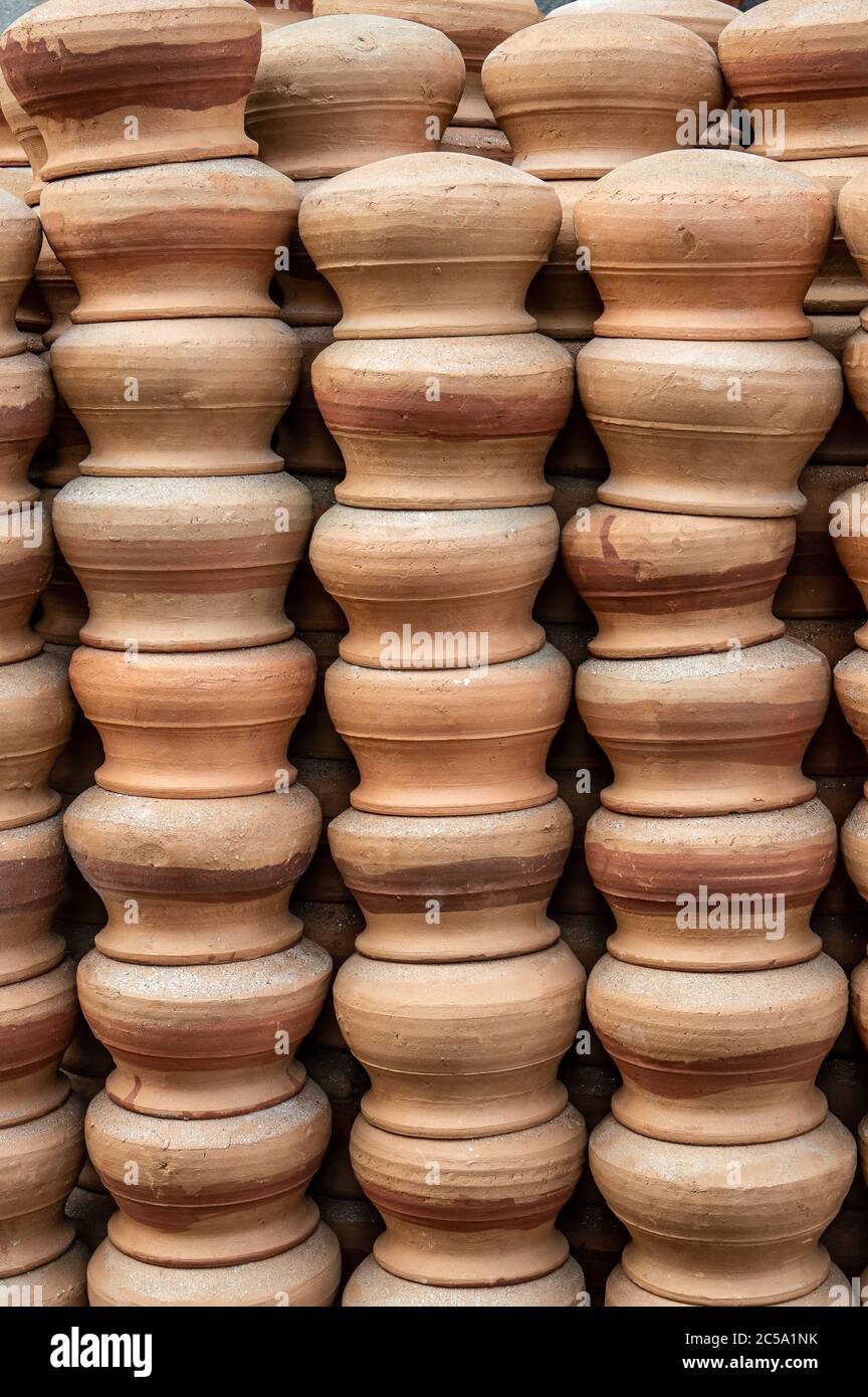 Terracotta pots put to dry before being baked. Stock Photo