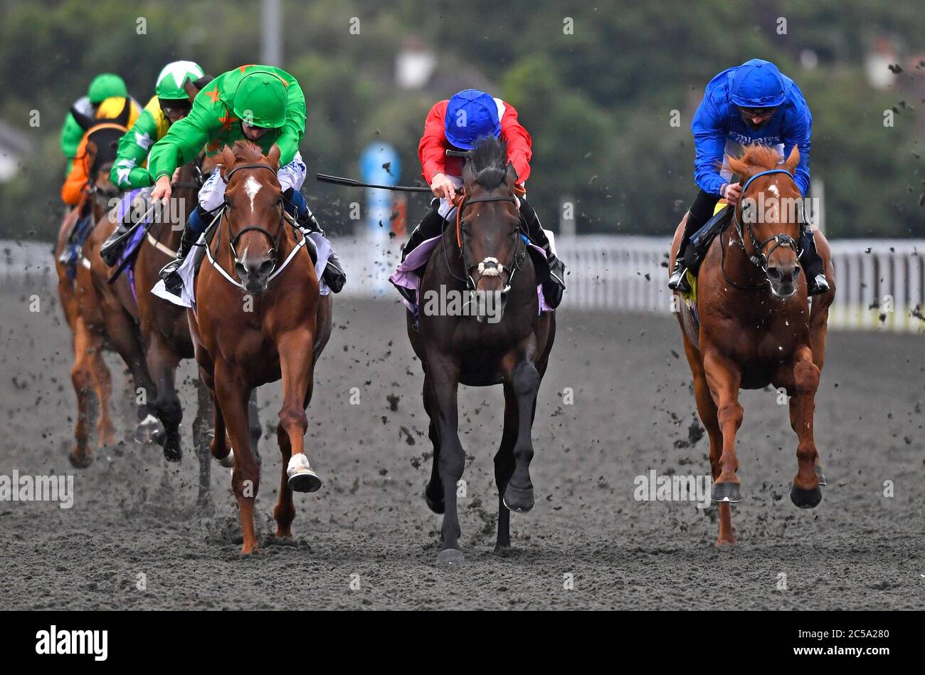 Inherent ridden by Ryan Moore (centre) wins the Unibet 3 Uniboosts A Day Novice Stakes at Kempton Park Racecourse. Stock Photo