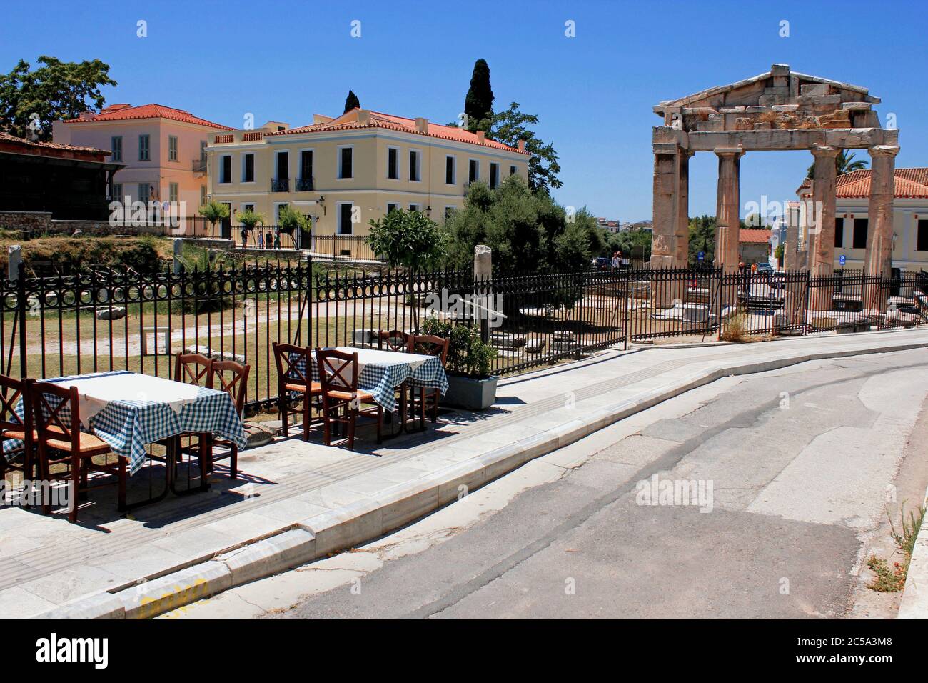 Greece, Athens, June 28 2020 - Empty chairs and tables of a traditional restaurant in the touristic district of Plaka. Despite the low coronavirus rat Stock Photo