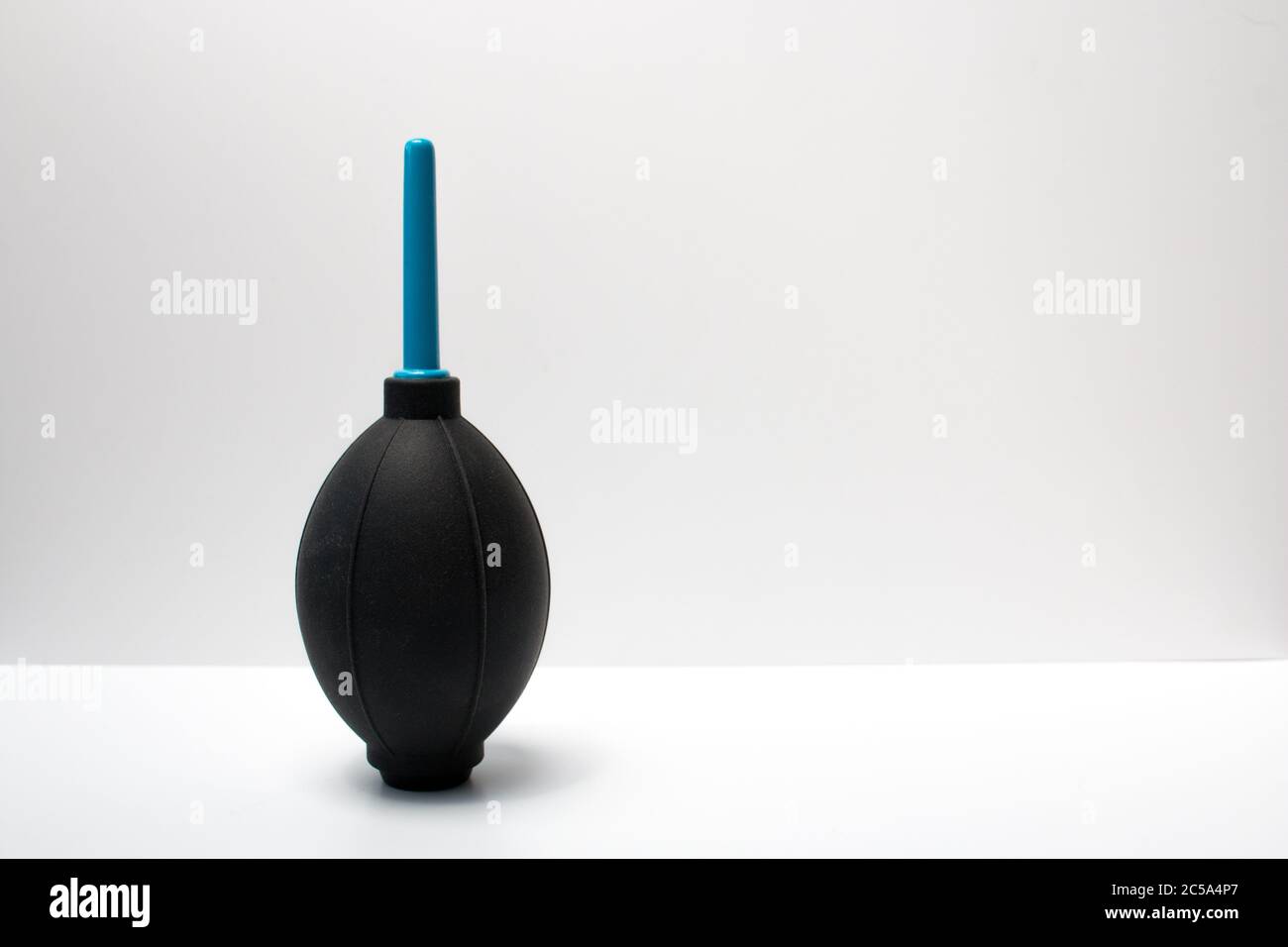 An air blower for cleaning the sensor and lens of a digital DSLR camera