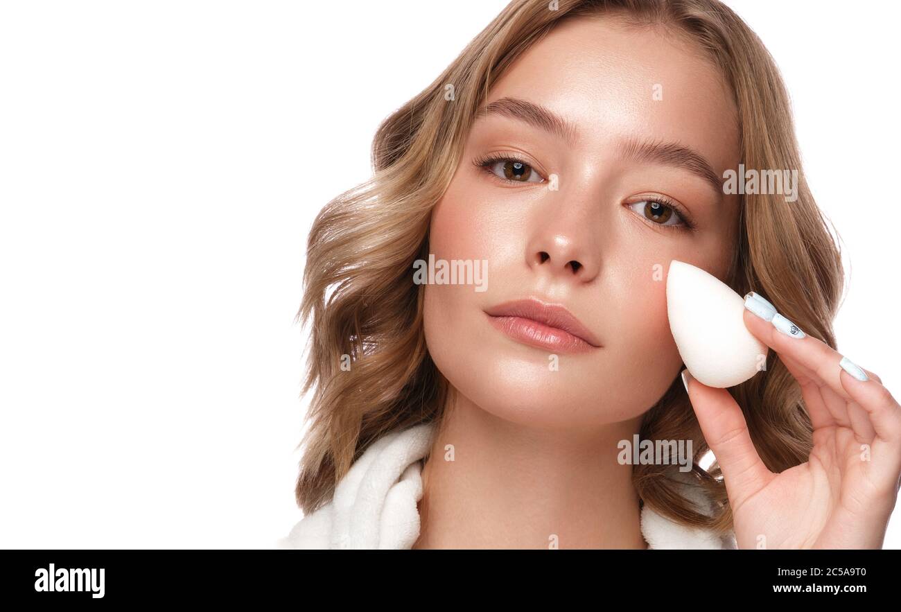 Beautiful tender young girl in a white coat with clean fresh skin ...