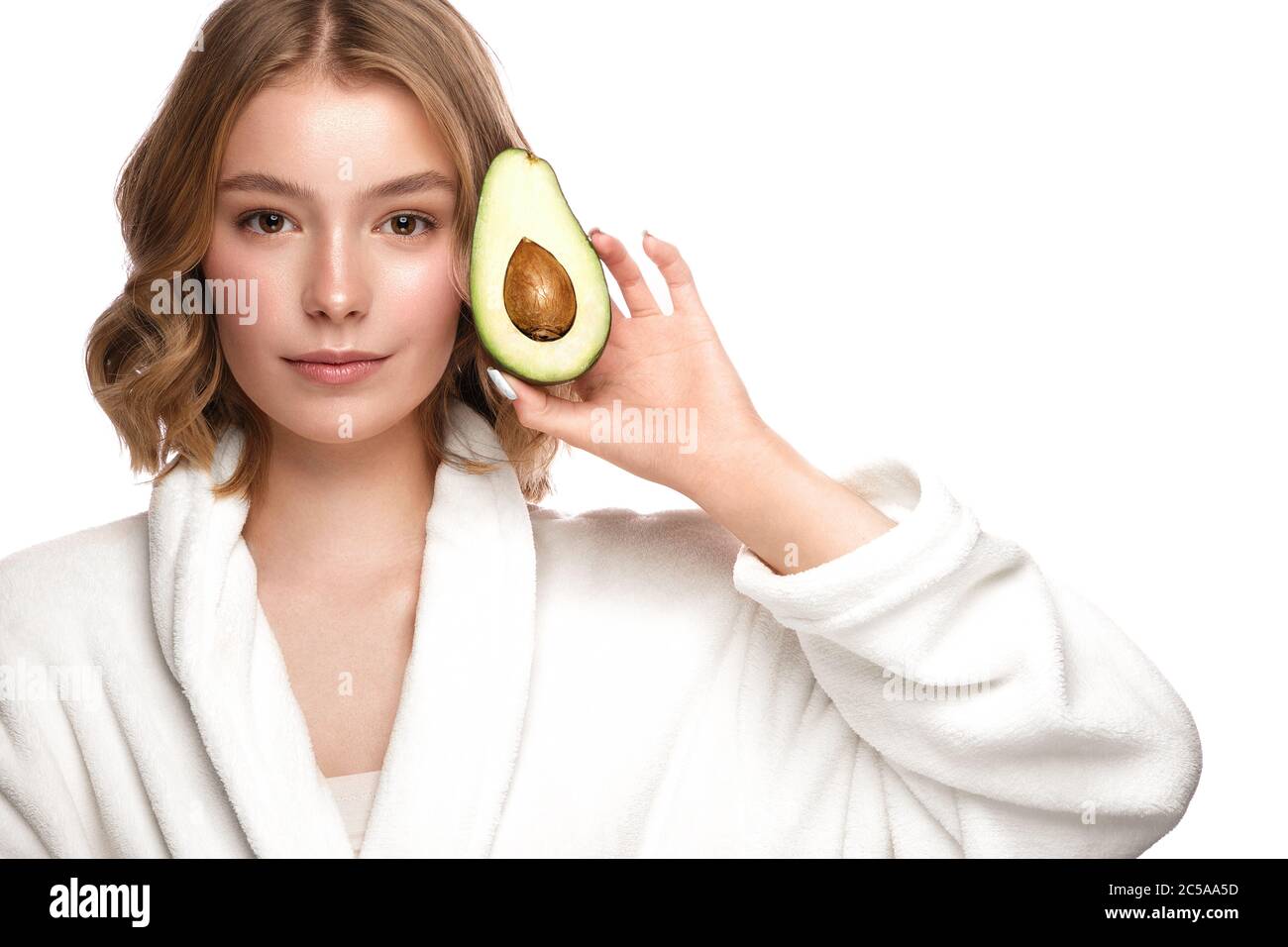 Beautiful tender young girl in a white coat with clean fresh skin ...
