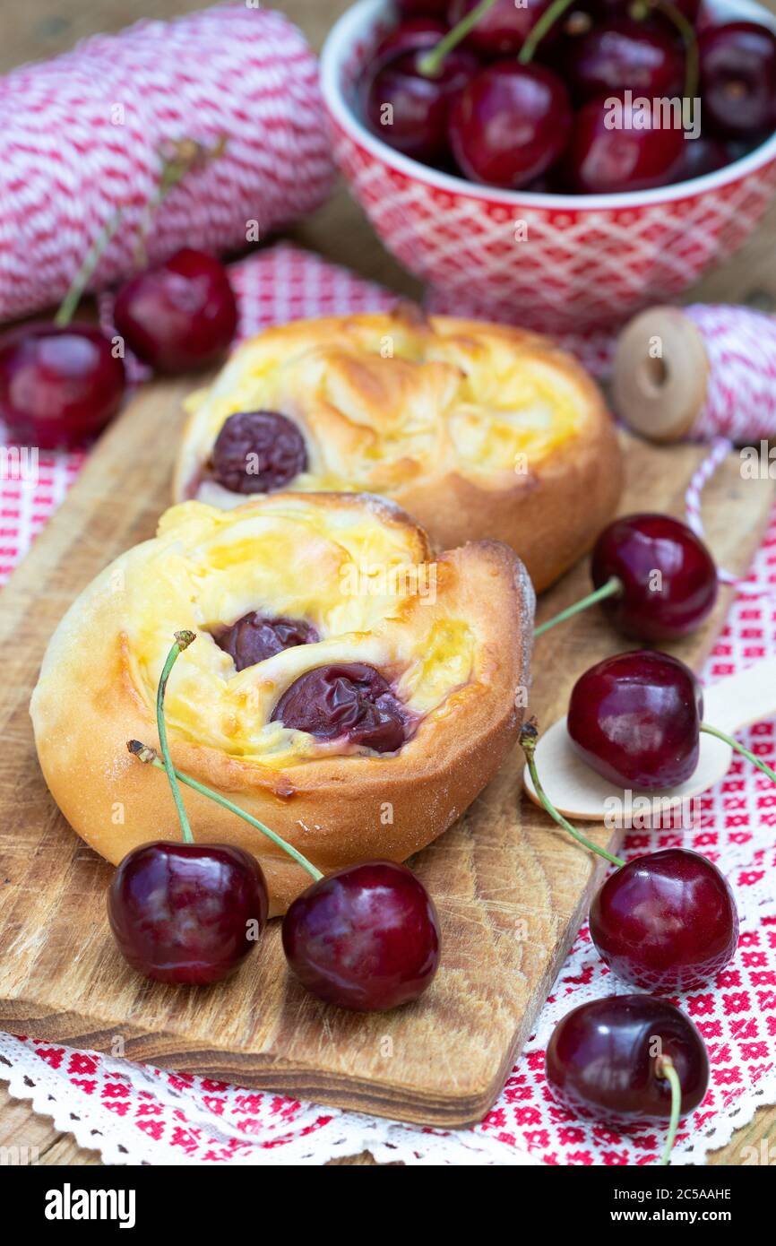 chelsea bun with cherry and vanilla pudding Stock Photo