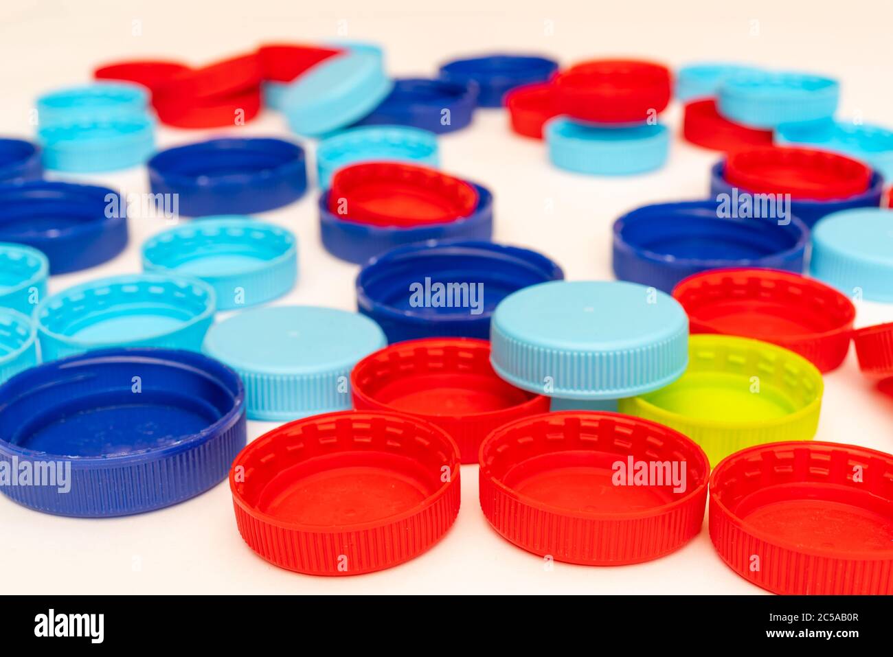 Plastic bottle caps. Separate garbage collection. Waste disposal Stock Photo Alamy