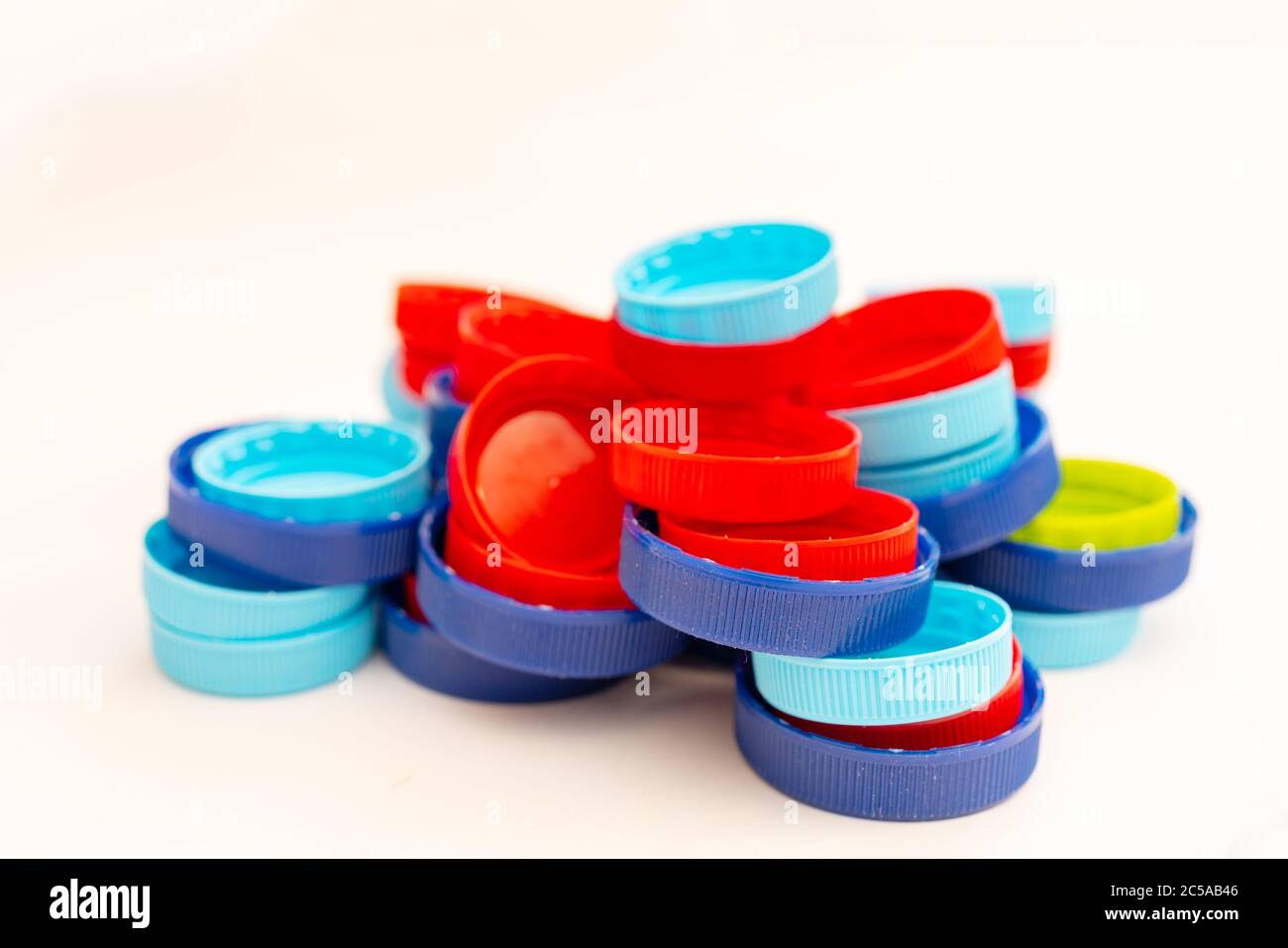 Plastic bottle caps. Separate garbage collection. Waste disposal Stock