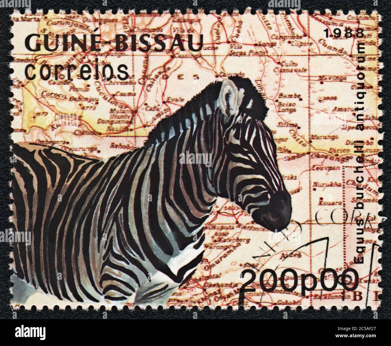 Postage stamp. Zebra, Equus burchelli antiquorum and the map of Africa,  Guinea Bissau , 1988 Stock Photo