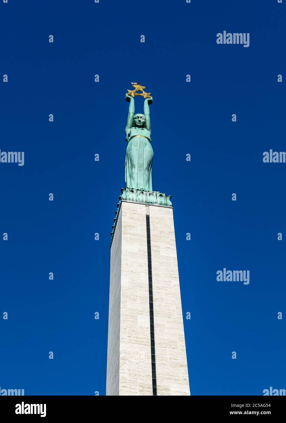 Copper figure of Liberty at the top of the Freedom Monument in Riga, Latvia Stock Photo