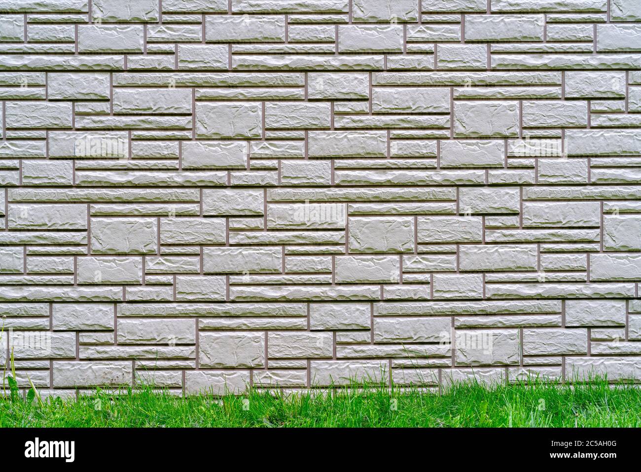 Gray brick wall. Dark abstract background. Building brick construction. Stock Photo