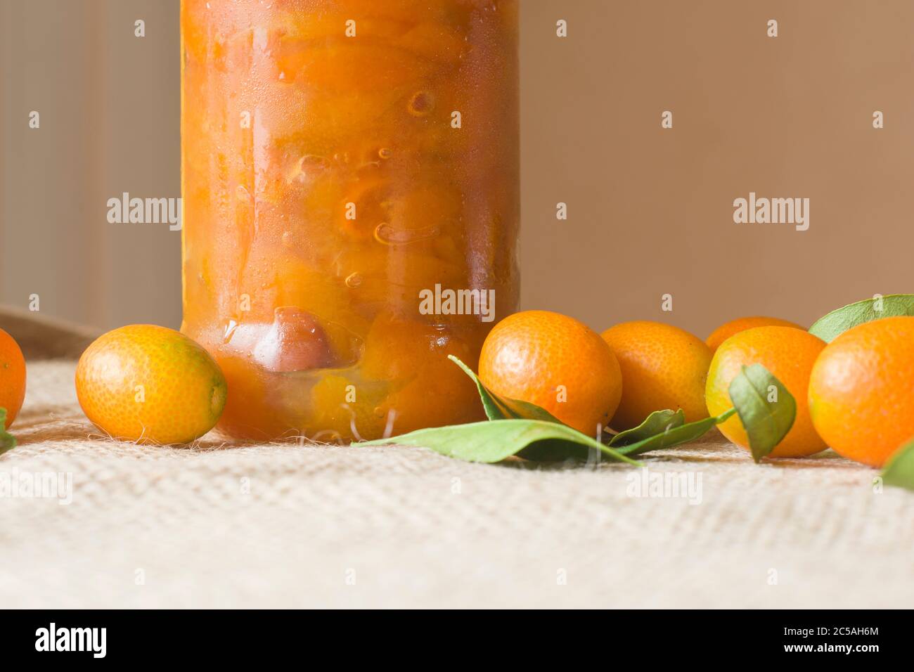 A jar full of kumquat's jam. Mandarin orange. healthy fruit Stock Photo