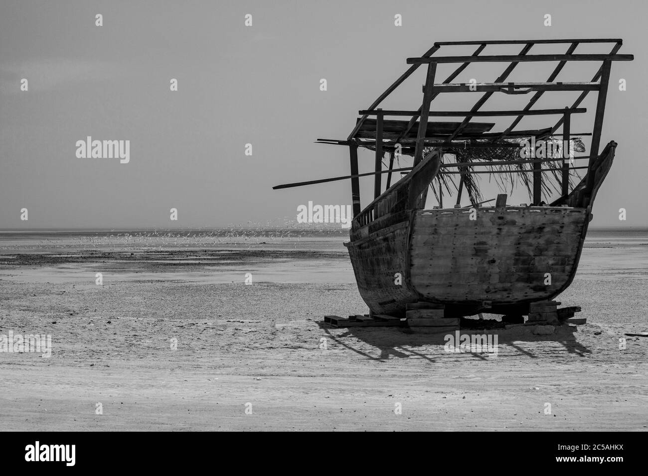 Traditional Dhow boats on display on the beach at Al Wakra Stock Photo