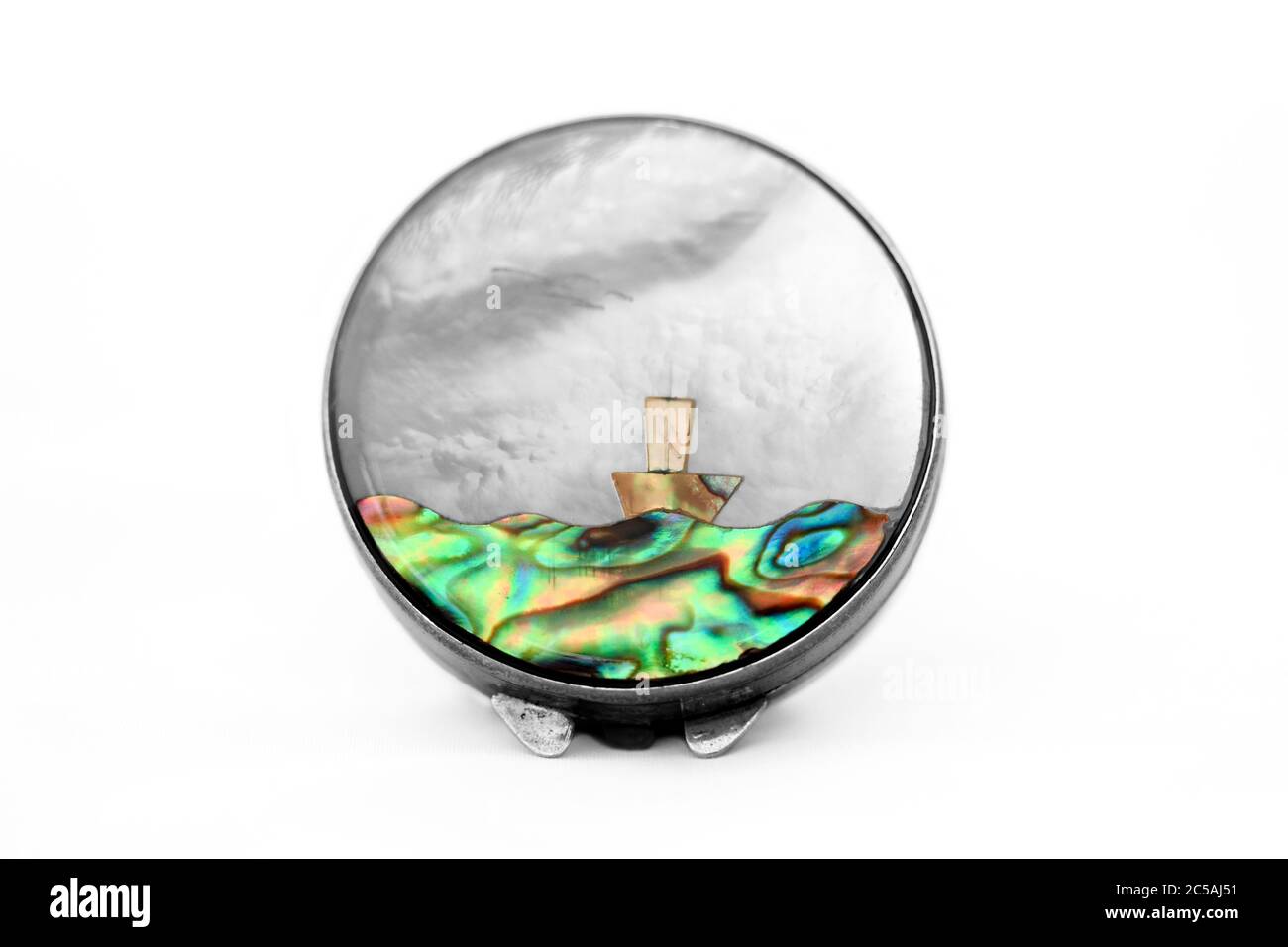 Small silver pill box, trinket box inlaid with mother of pearl, paua, nacre Stock Photo