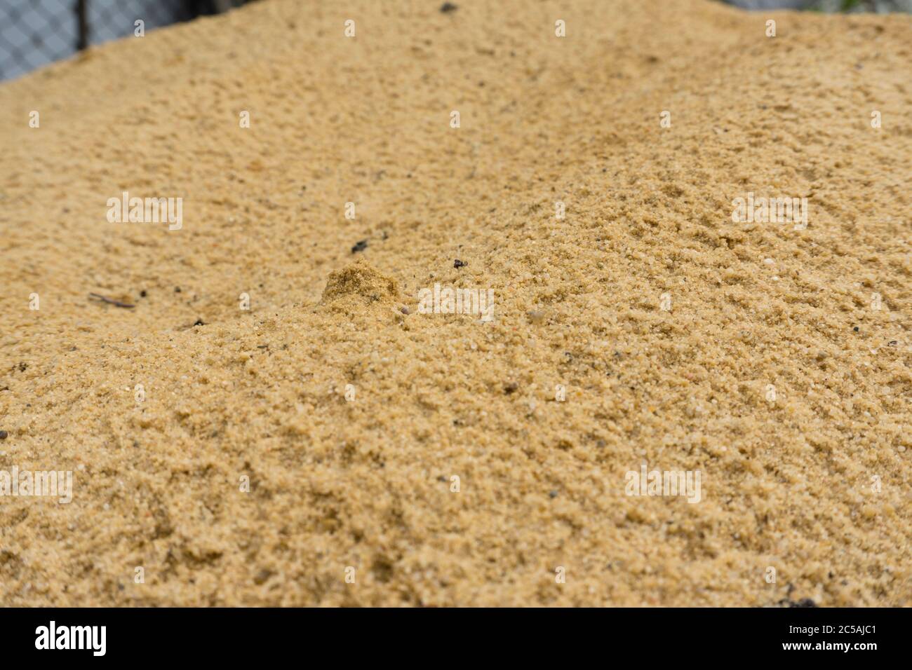 Close up sand background. Sunny sand texture Stock Photo - Alamy