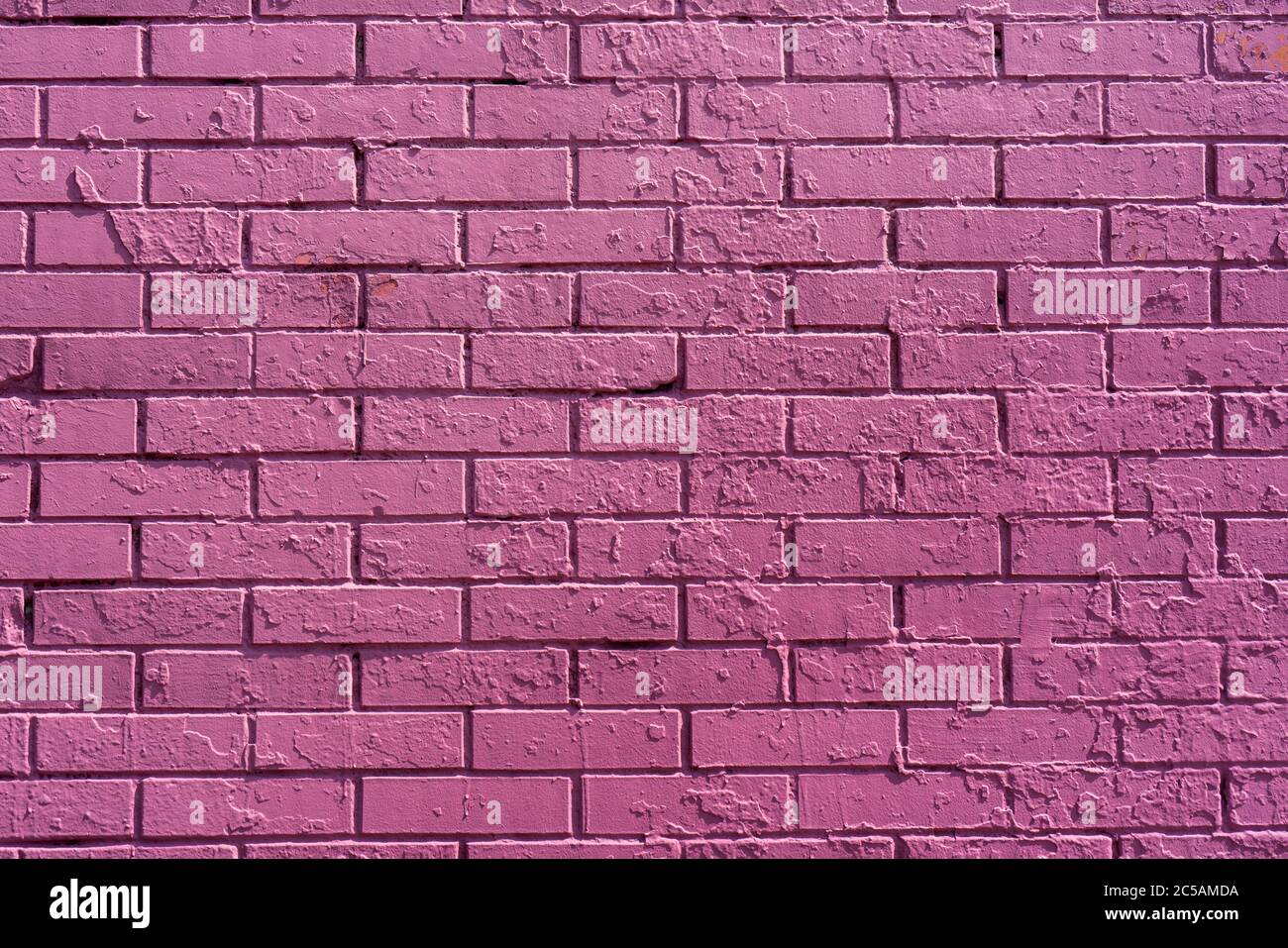 Pink brick wall of building. Brick texture. Architectural abstract pink