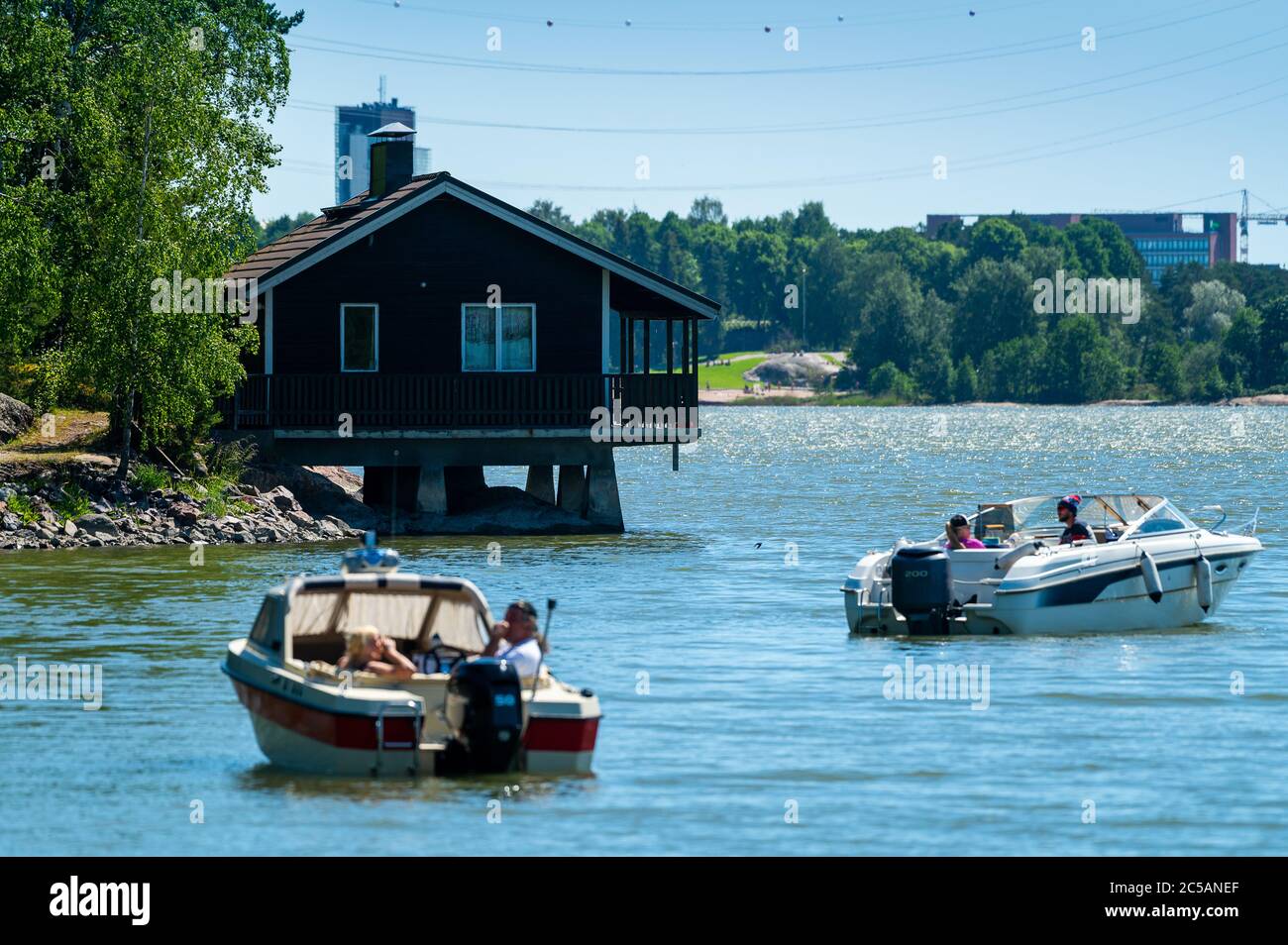 Helsinki / Finland - JUNE 21, 2020: An old wooden Finnish sauna building standing on top of the water. Stock Photo