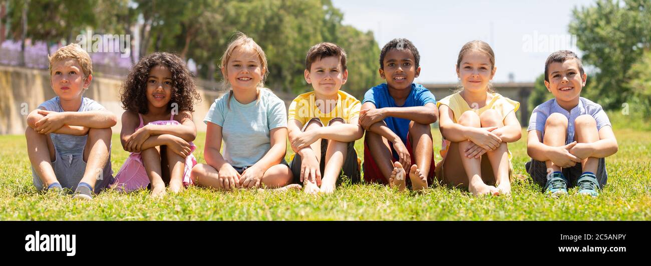 Portrait of children who are posing in the summer park Stock Photo - Alamy
