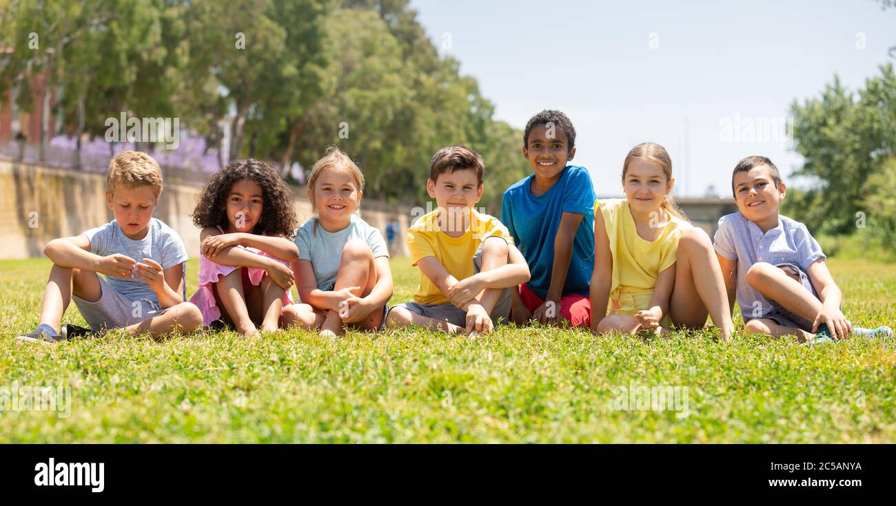 Portrait of children who are posing in the summer park Stock Photo - Alamy