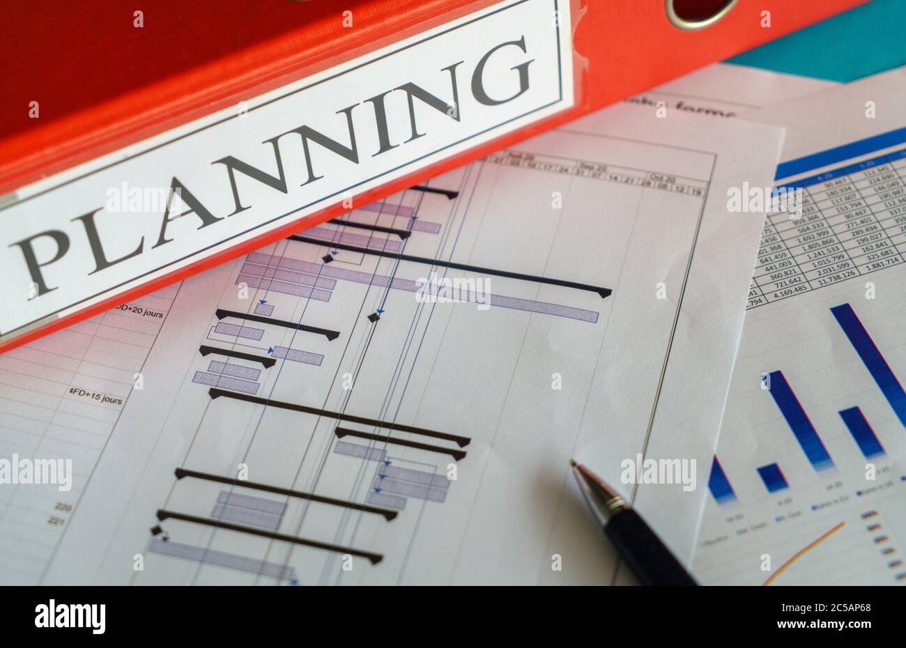 Construction project planning, management concept, gantt chart schedule, blueprints, helmet, calculator different management tools Stock Photo