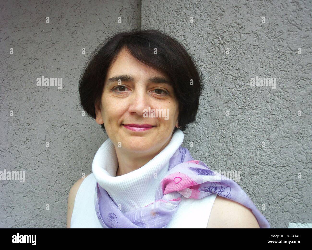 Woman with a smile and short black hair Stock Photo