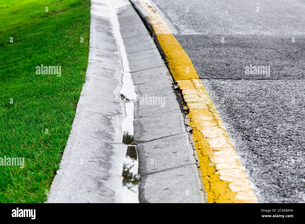 flowing rainwater in the canal is a cement ditch of a drainage system