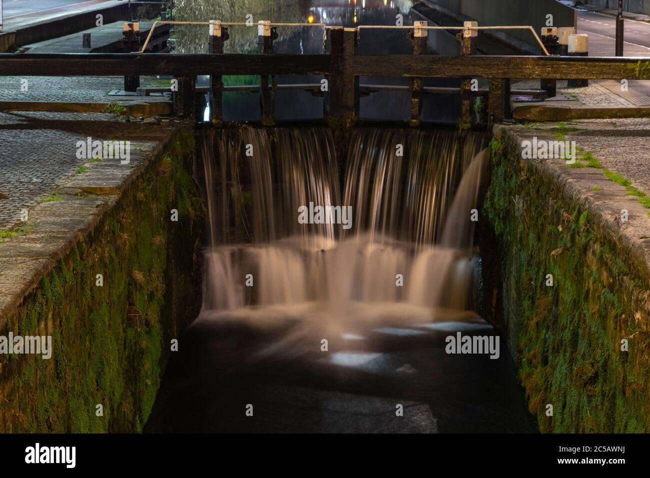 slow shutter speed canal lock at night Stock Photo