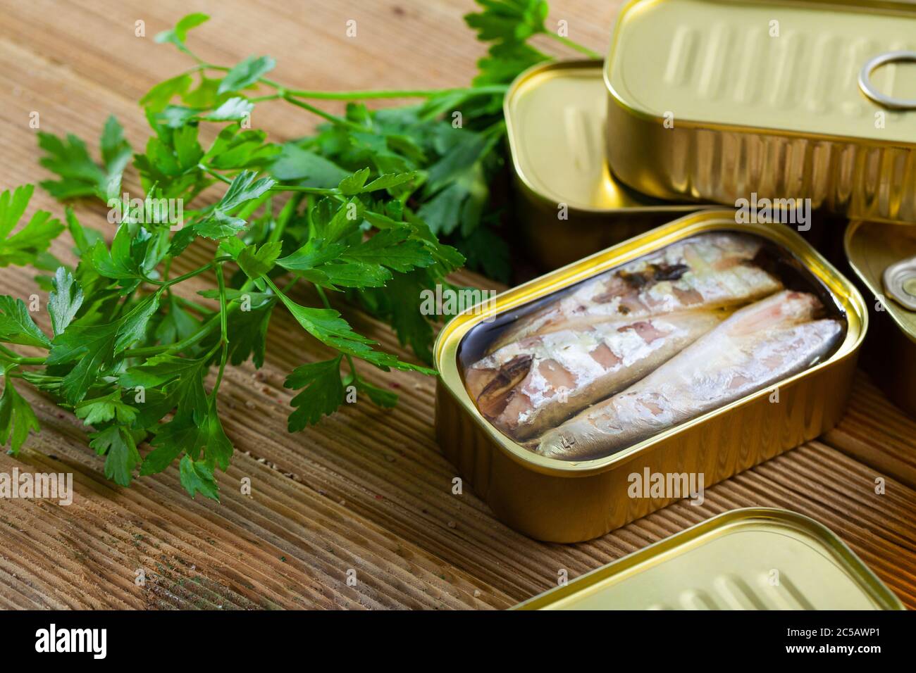 Picture of tasty canned mackerel fish in sunflower oil with greens at