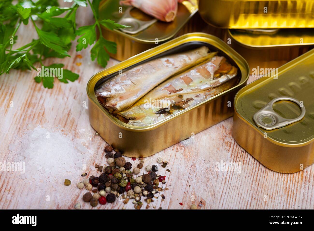 Image of salty fillet of mackerel in sunflower oil in open tin can