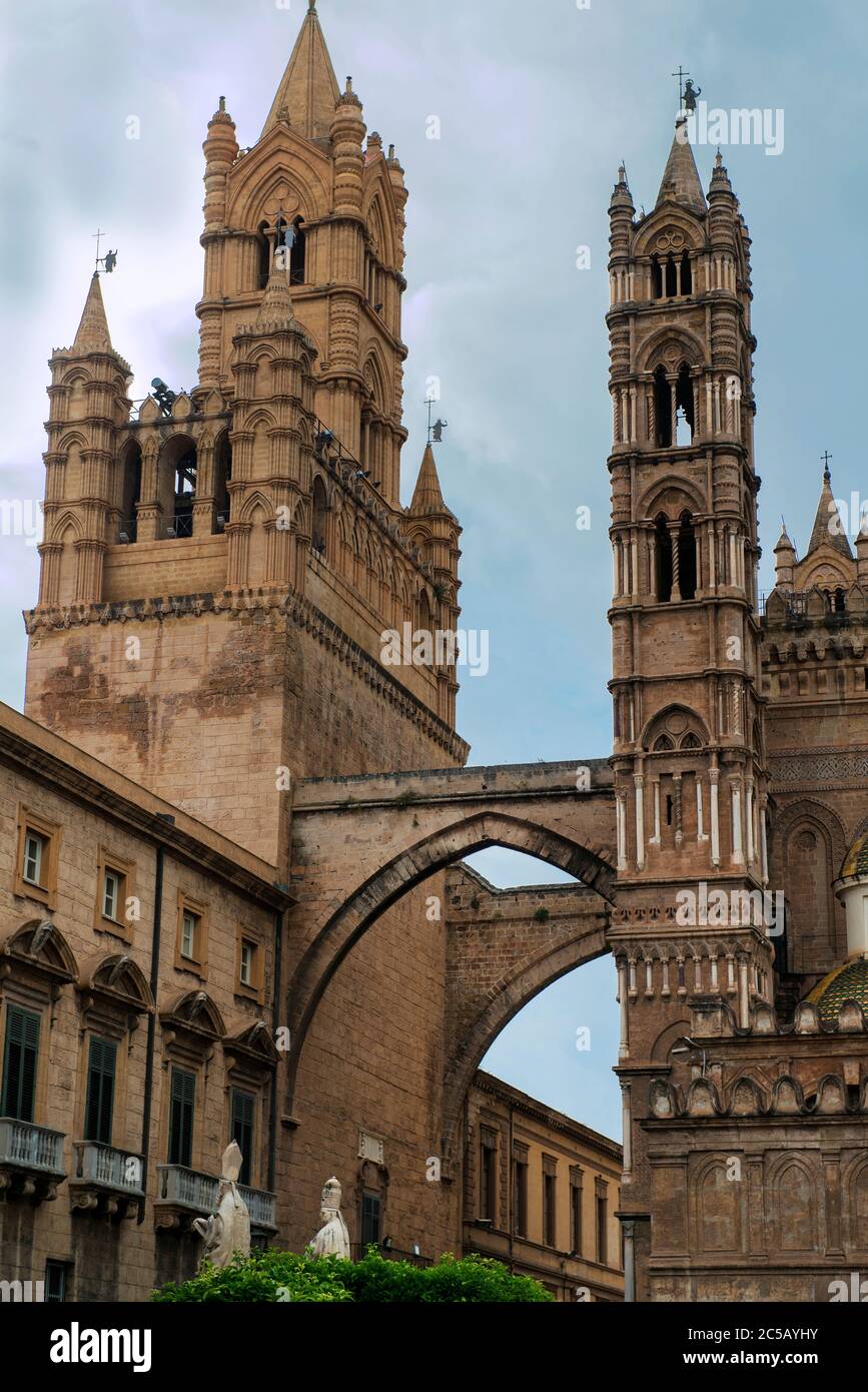 Palermo Cathedral is connected, through two pointed arches, with the Archbishop's Palace, making the church look like a castle, Palermo, Sicily, Italy Stock Photo
