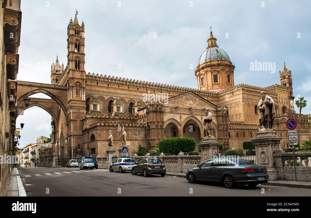 Palermo Cathedral is connected, through two pointed arches, with the Archbishop's Palace, making the church look like a castle, Palermo, Sicily, Italy Stock Photo