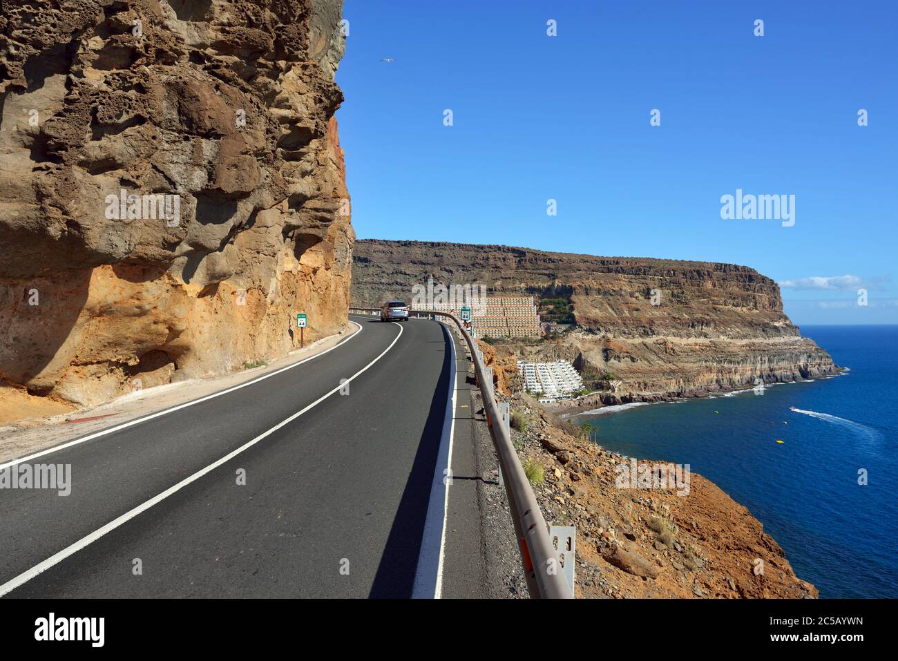 Road along the south coast of Gran Canaria. View on Taurito resorts. It is popular resort of island with public beach, shopping facilities and restaur Stock Photo