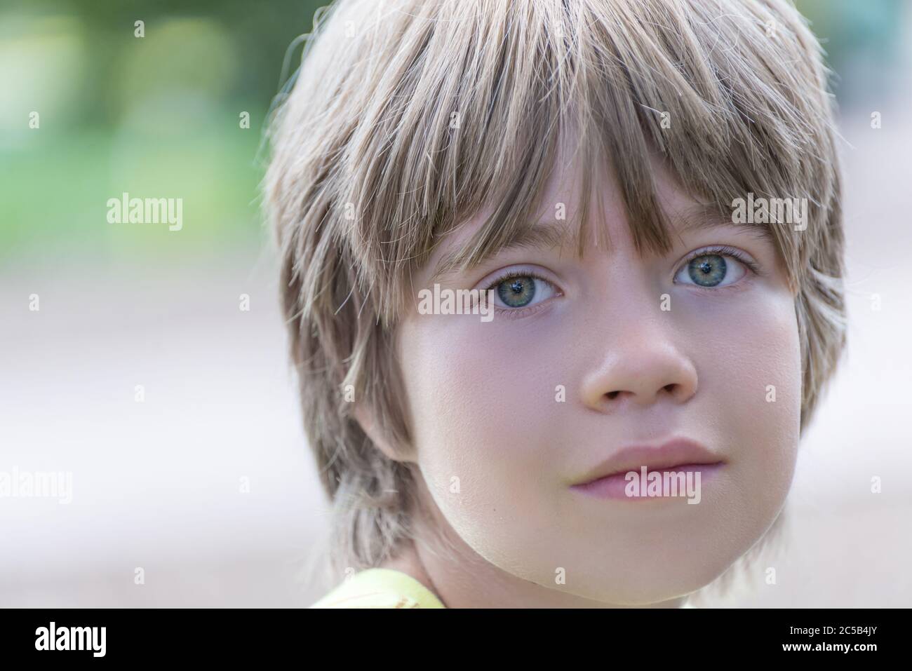 Portrait of a boy with a striking blue eyes Stock Photo